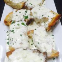 Garlic Fromage · Toasted Italian garlic bread topped with a creamy four cheese sauce
