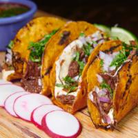 Tres Birria Tacos · Taco trio, tender shredded beef, Jack cheese, diced red onions, chopped cilantro, side of ad...