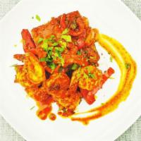 Smoked Paprika and Tomato Prawns · Spicy jumbo prawns, sautéed with onions, peppers, cherry tomatoes, and fresh herbs in a smok...