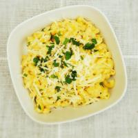 Mac and Cheese · Macaroni in a smoked Mozzarella and Parmesan cream sauce, topped with fresh herbs.