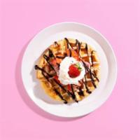  Strawberry Chocolate Waffle · A fluffy Belgian waffle drizzled with chocolate sauce and topped with strawberries, maple sy...