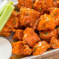 8 Pieces Classic Buffalo Wings · Classic bone in Wings, sauced and tossed with Buffalo sauce. 