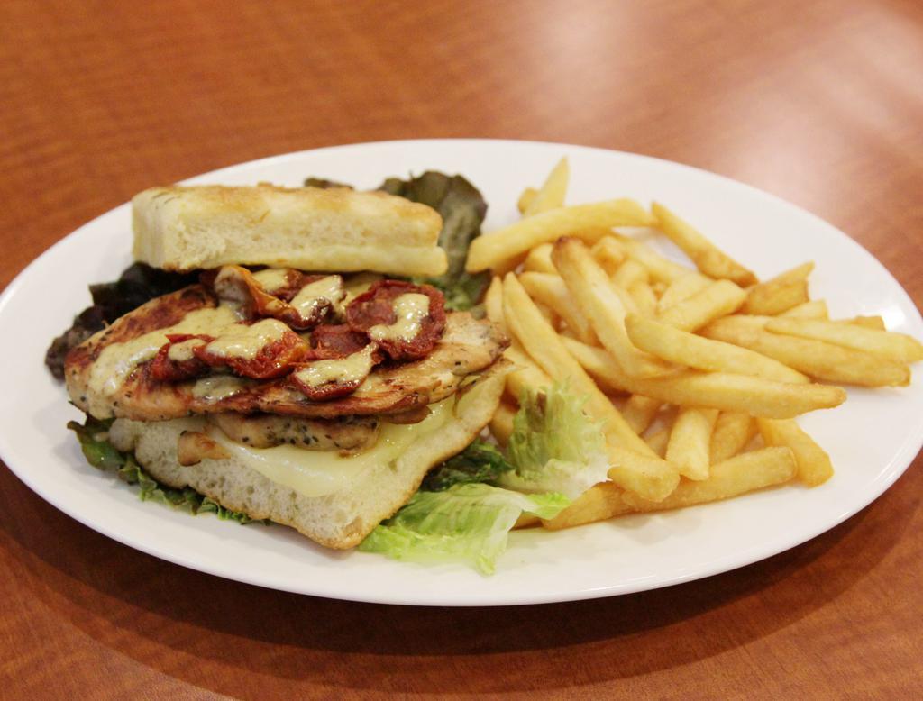 California Club Sandwich · Grilled marinated chicken breast with sun-dried tomatoes, mozzarella and honey mustard sauce on focaccia bread. Served with french fries.