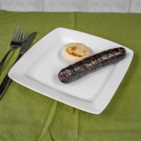 Morcilla con Arepa · Blood sausage with corn cake.