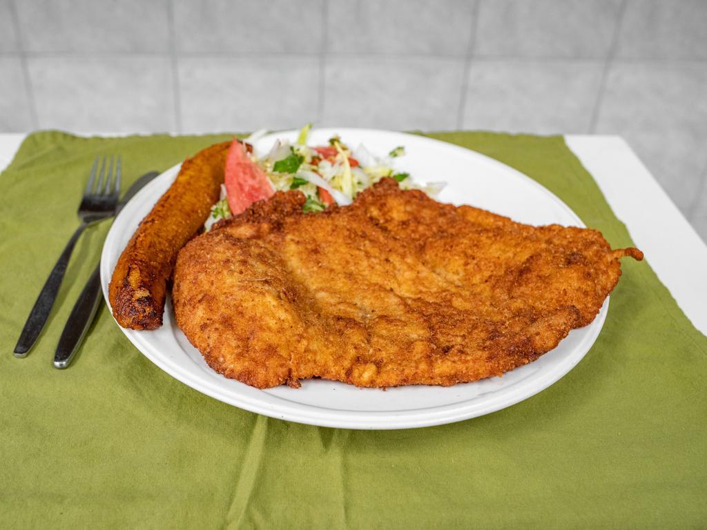 Lomo de Cerdo Empanizado · Breaded pork loin, rice, beans, and salad.