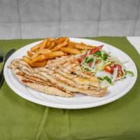 Pechuga a la Plancha · Grilled chicken breast, rice, beans, salad, and french fries.