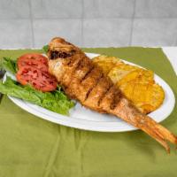 Pargo Rojo Frito · Fried snapper with rich green plantain.