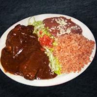13. Mole de Pollo · Chicken. Served with rice and beans.