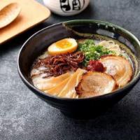 Classic Tonkotsu Ramen · Egg,  Pork Chashu  ,   
wakame , bamboo shoots and scallion.
