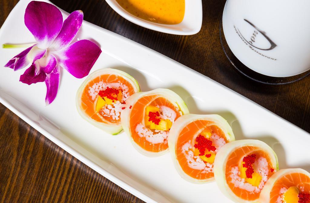 Passion Fruit Roll · Salmon, mango, kani and masago wrapped with paper thinly sliced cucumber.