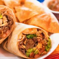Steak Burrito · Mexican rice, pinto beans, lettuce, Monterey jack cheese, sour cream, and our homemade salsa...