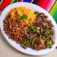Bistec a la Mexicana · Grilled chopped tender steak accompanied with onions, tomatoes, serrano peppers, and fresh c...
