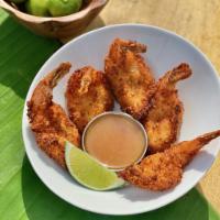 Coconut Shrimp · 5 shrimp hand dipped in citrus-coconut batter, fried crisp and served with orange dipping sa...