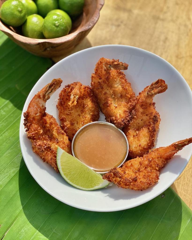 Coconut Shrimp · 5 shrimp hand dipped in citrus-coconut batter, fried crisp and served with orange dipping sauce