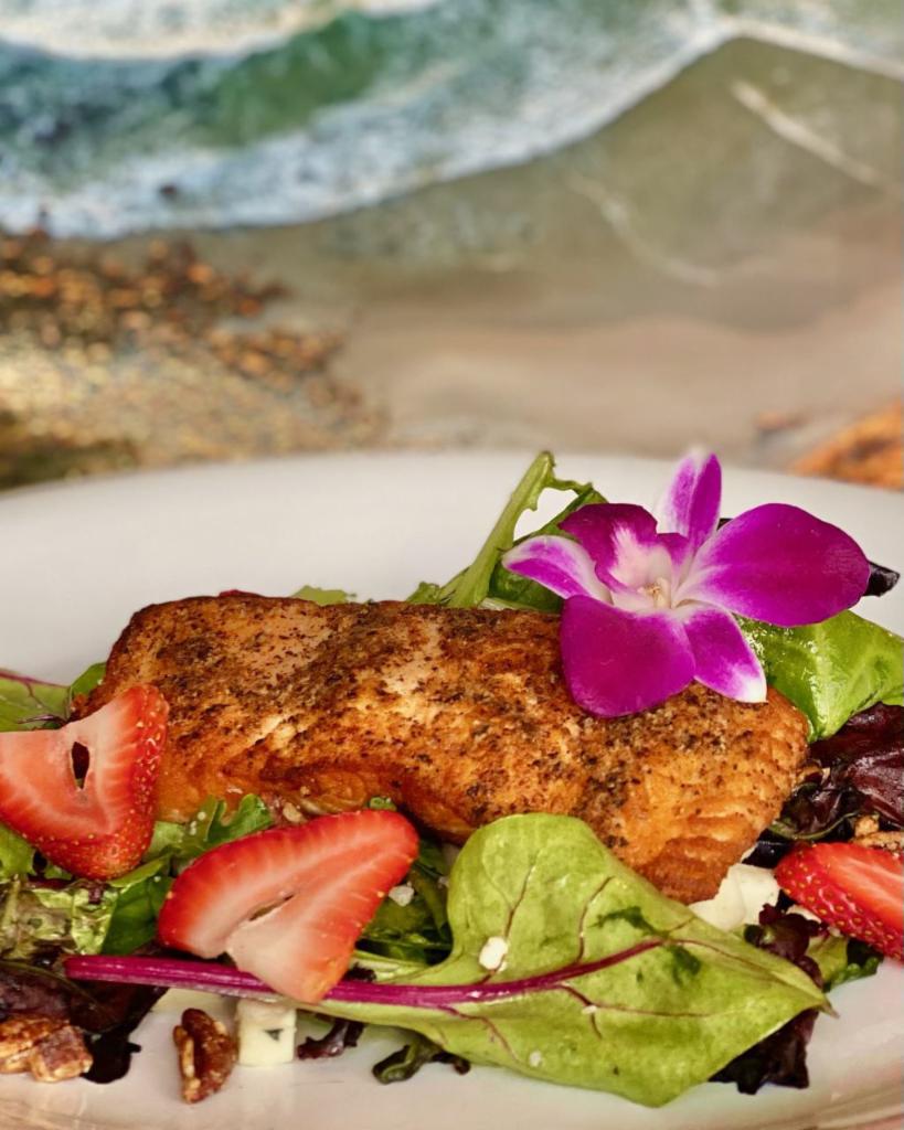 Salmon Salad · Seared salmon filet over mixed greens with strawberries, toasted pecans, bleu crumbles  and citrus vinaigrette