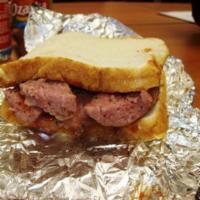 Elgin Beef Sausage Sandwich · Sliced hickory-smoked Elgin, Texas sausage served on Texas Toast with your choice of onions,...