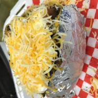 Baked Potato · Traditional baked potato served with your choice of toppings.