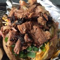 Brisket Baked Potato · Slow-smoked BBQ Beef Brisket chopped and served atop a baked potato filled with your choice ...