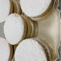 Alfajores · Peruvian cookies filled with dulce de leche and topped with powdered sugar.