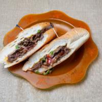 Classic Philly Cheese Steak Sandwich · Homemade steak, peppers, onion and cheese.