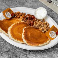 Nut Filled Pancakes · 3 butter milk pancakes loaded with your choice of almond, walnut, chocolate chips, pecan, or...