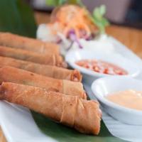 Shrimp Blanket · 5 pieces. Shrimp marinated in Thai seasonings, crabmeat, green onions, in a crispy wrap serv...
