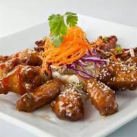 Noodle Wave Wings · 6 pieces. Almond siracha sauce or Thai-style.