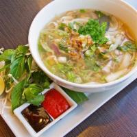 Vietnamese Noodle Soup · A fragrant clear broth noodle soup with onions, scallions, and a side of bean sprout and bas...