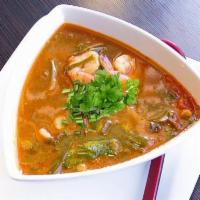 Tom Yum Soup · A tasty, spicy combination of herbs, mushrooms, tomatoes, cilantro, lemongrass, galangal roo...
