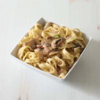 Fettuccine della Mamma · With prosciutto, peas, mushrooms and cream.