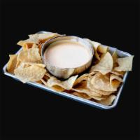 Chips & Queso · Thick and Creamy Melted Cheese, served with Tortilla Chips