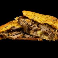 Brisket Grilled Cheese · Slow-Cooked Tender Brisket on Texas Toast Served With Monterey Jack cheese, Dressed With Stu...