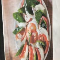 Mozzarella Caprese Salad · Fresh mozzarella, tomatoes, fresh basil, olive oil, balsamic vinegar.