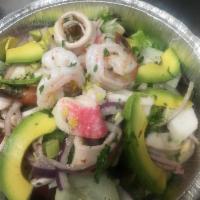 Seafood Salad · Shrimp, calamari, red crabmeat, mixed greens, celery, cucumbers, tomatoes, onions and avocad...