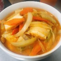 Massaman Curry · Massaman curry paste in coconut milk soup, potato, onion, peanut served with jasmine rice.