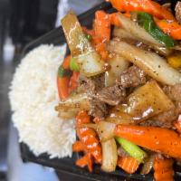 Black Pepper Beef · Stir fry beef with onion, black pepper, bell pepper, green onion and carrot served with. Jas...