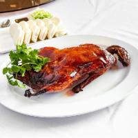 51. Peking Duck · Cooked until crispy and covered in a sweet and savory sauce.