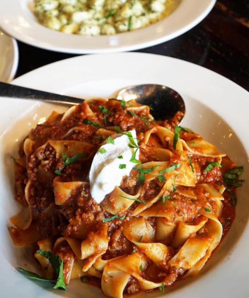 Pappardelle alla Bolognese · Meat ragu topped with mascarpone. 