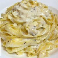 Fettuccine Alfredo · Cream sauce and Parmigiano cheese. Vegetarian dish.