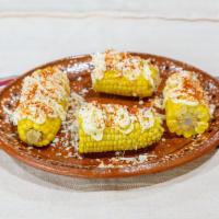 Elotes · Mexican street corn coated with mayonnaise, queso panda and chile tajin.