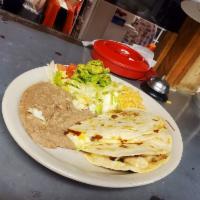 Quesadila PIate · Chicken or beef fajita served with rice, beans, side salad and avocado 