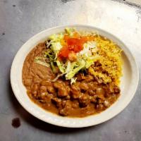 Carne Guisada Plate · Served with rice and beans