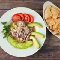 Agua Chile's · Prawns tossed in a spicy lime citrus sauce with avocado, cucumber's, onions.