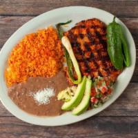 Pollo Asado · A grilled chicken breast served with rice, beans, avocado, pico de gallo, fried jalapeno, an...