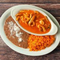 Pollo a La Crema · Grilled chicken sauteed with mushrooms, onions, ina delicious cream sauce served with rice, ...