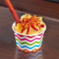 8 oz. Mangonada Ice Cream · Mango nectar ice cream, mango, tajin, chamoy and tamarindo stick.