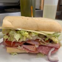 Italian Sub Sandwich · Salami, pepperoni, ham, cheddar cheese, tomatoes, red onions, olives, and lettuce.