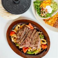 Fajita's for 4 · 1 dozen2 lbs of Meat with bell peppers, onions, 1 dozen tortillas, refried beans, rice, sals...
