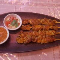 Chicken Satay · Served with peanut sauce and cucumber relish.