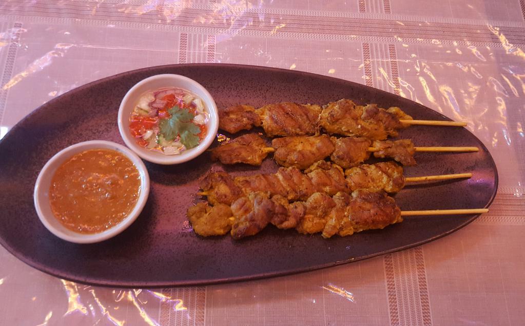 Chicken Satay · Served with peanut sauce and cucumber relish.